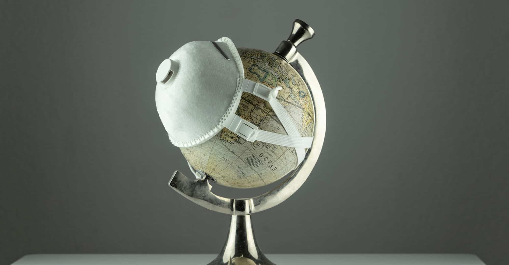 Reasons to Update Your Estate Plan Today - Globe with Mask Unexpected Occurences